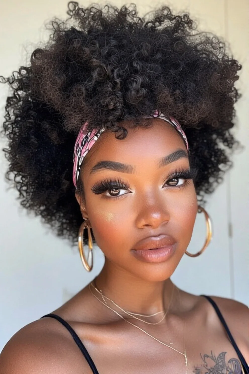 Afro puff hairstyle accessorized with a headband