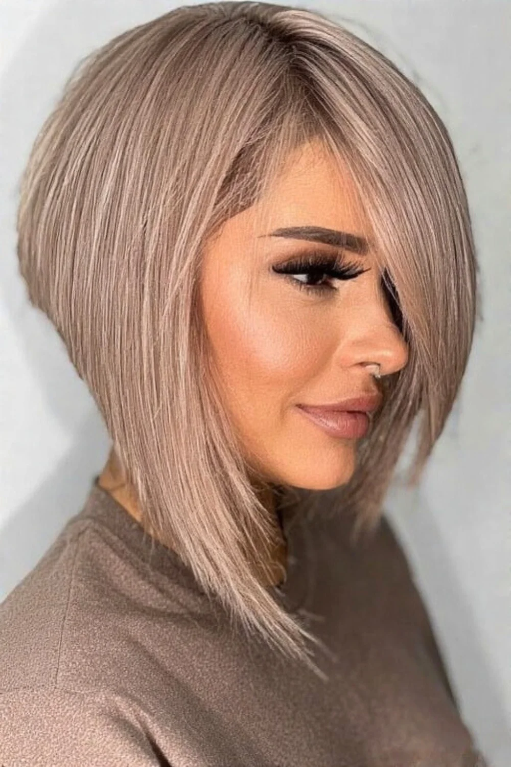 Asymmetrical long pixie bob with modern and stylish layers. 