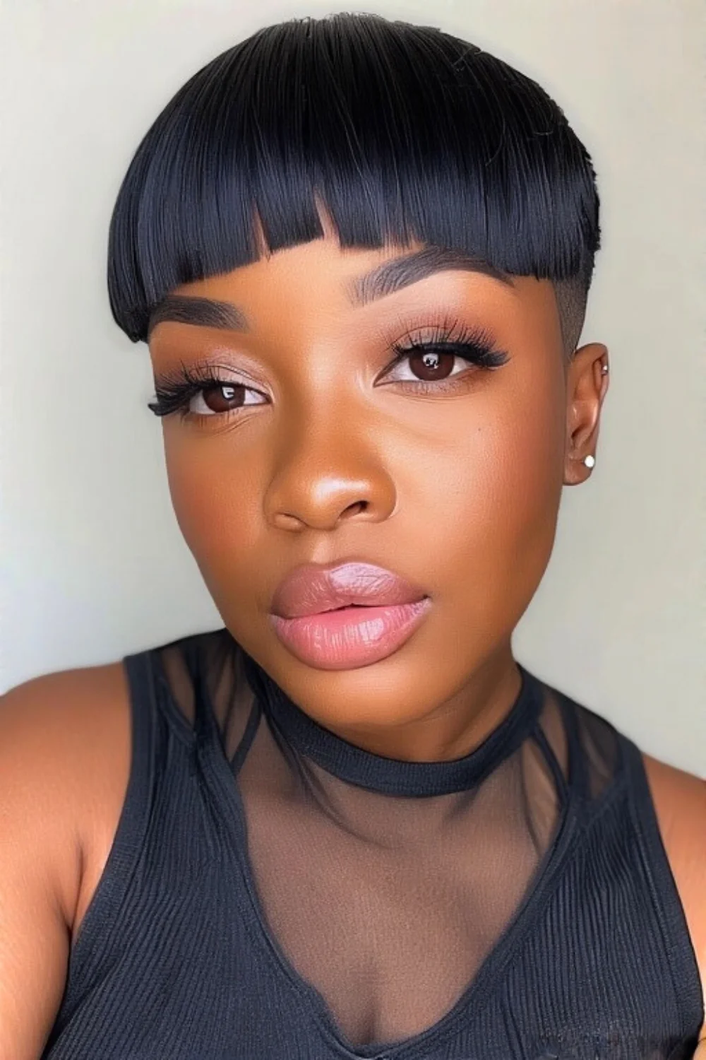 Blunt haircut paired with straight bangs
