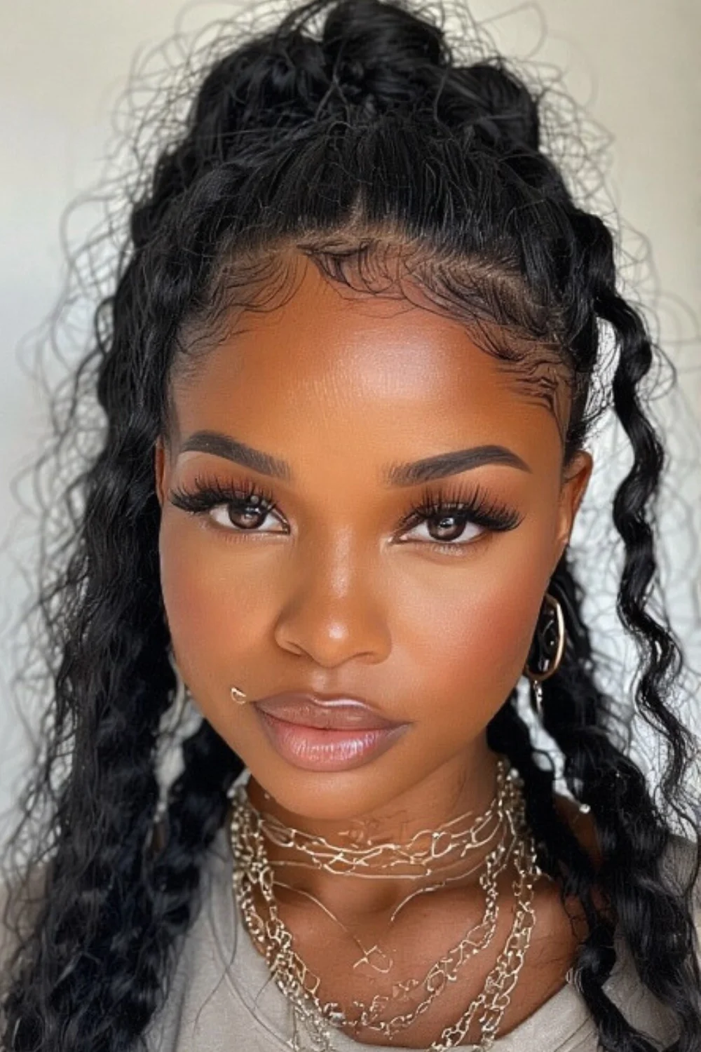 Crimped hair styled into a high ponytail