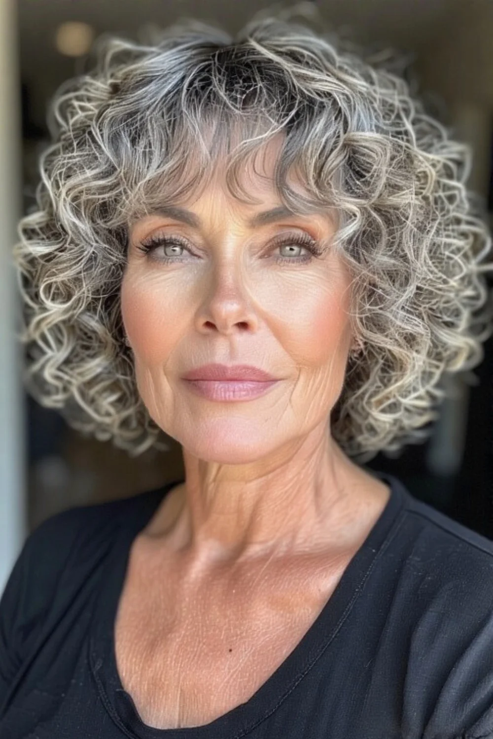 Curly bob hairstyle with bangs for women
