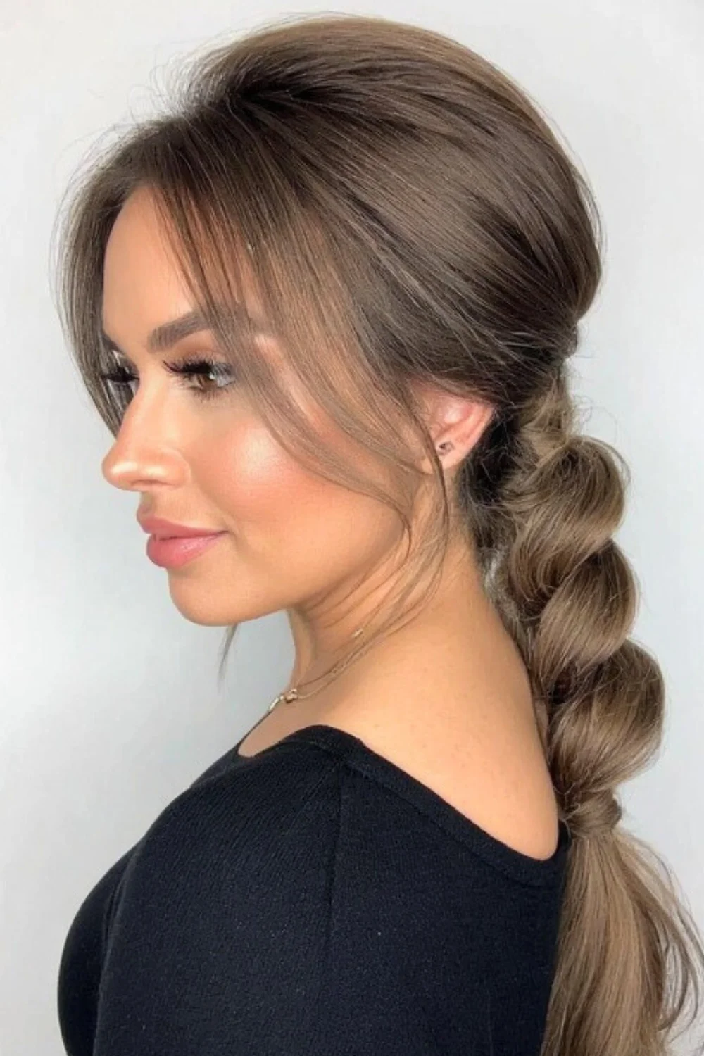 Stylish knotted low ponytail hairstyle
