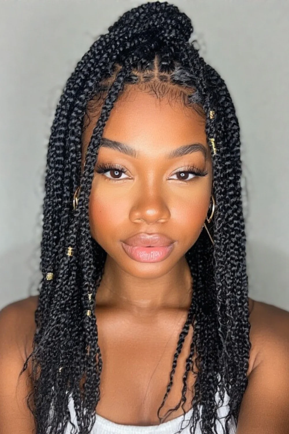 Micro braids styled with decorative hair clips