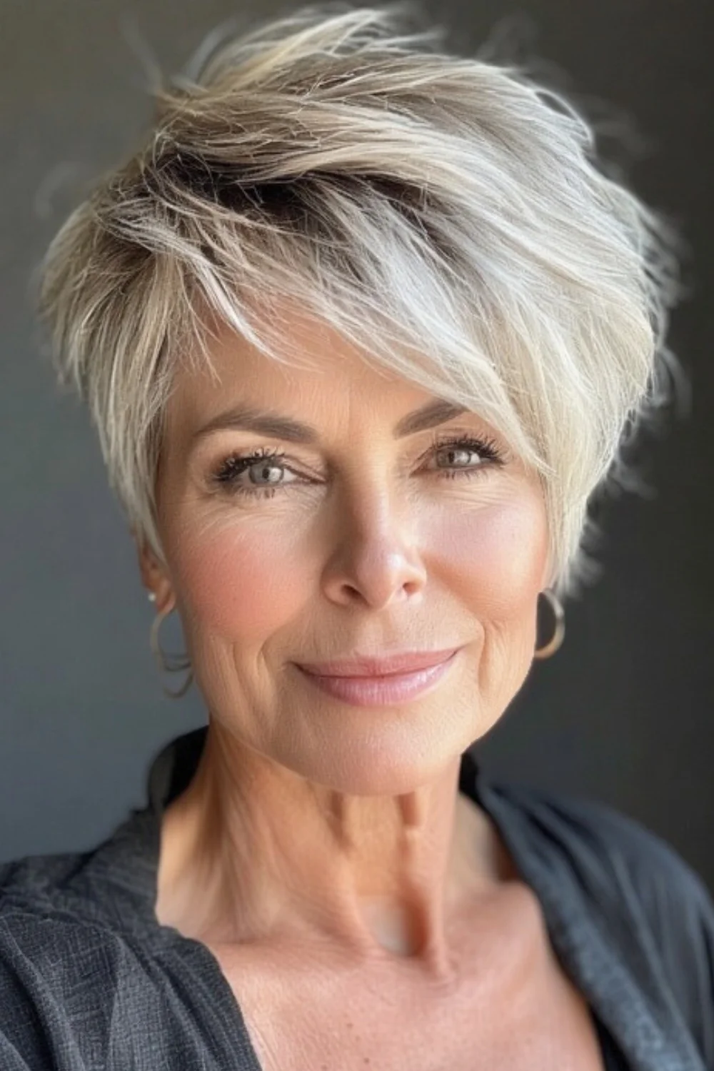 Trendy pixie cut styled with a bold pompadour front 