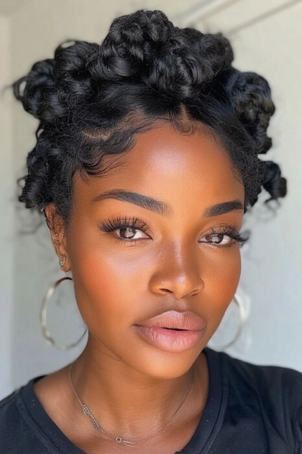 Natural hair styled in classic bantu knots
