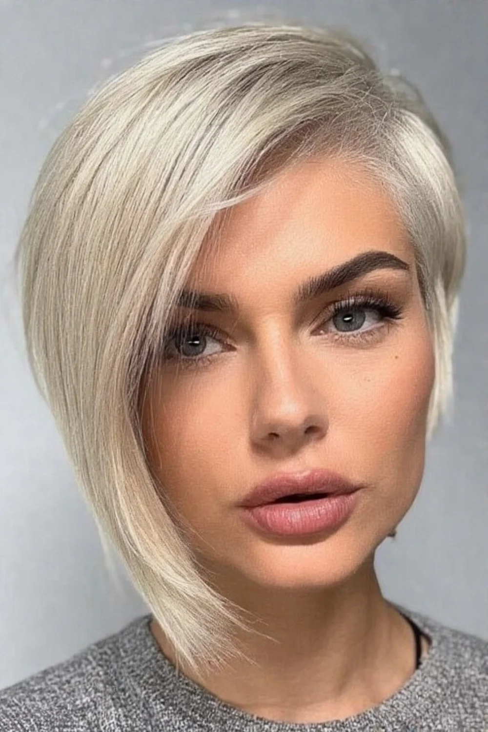 Pixie bob haircut with soft side swept bangs
