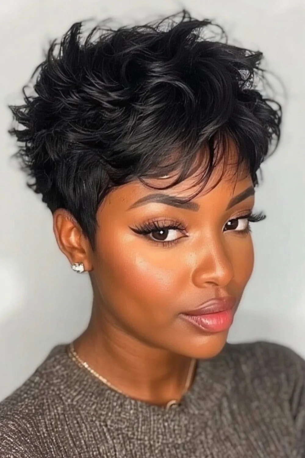 Stylish pixie cut hairstyle featuring bangs
