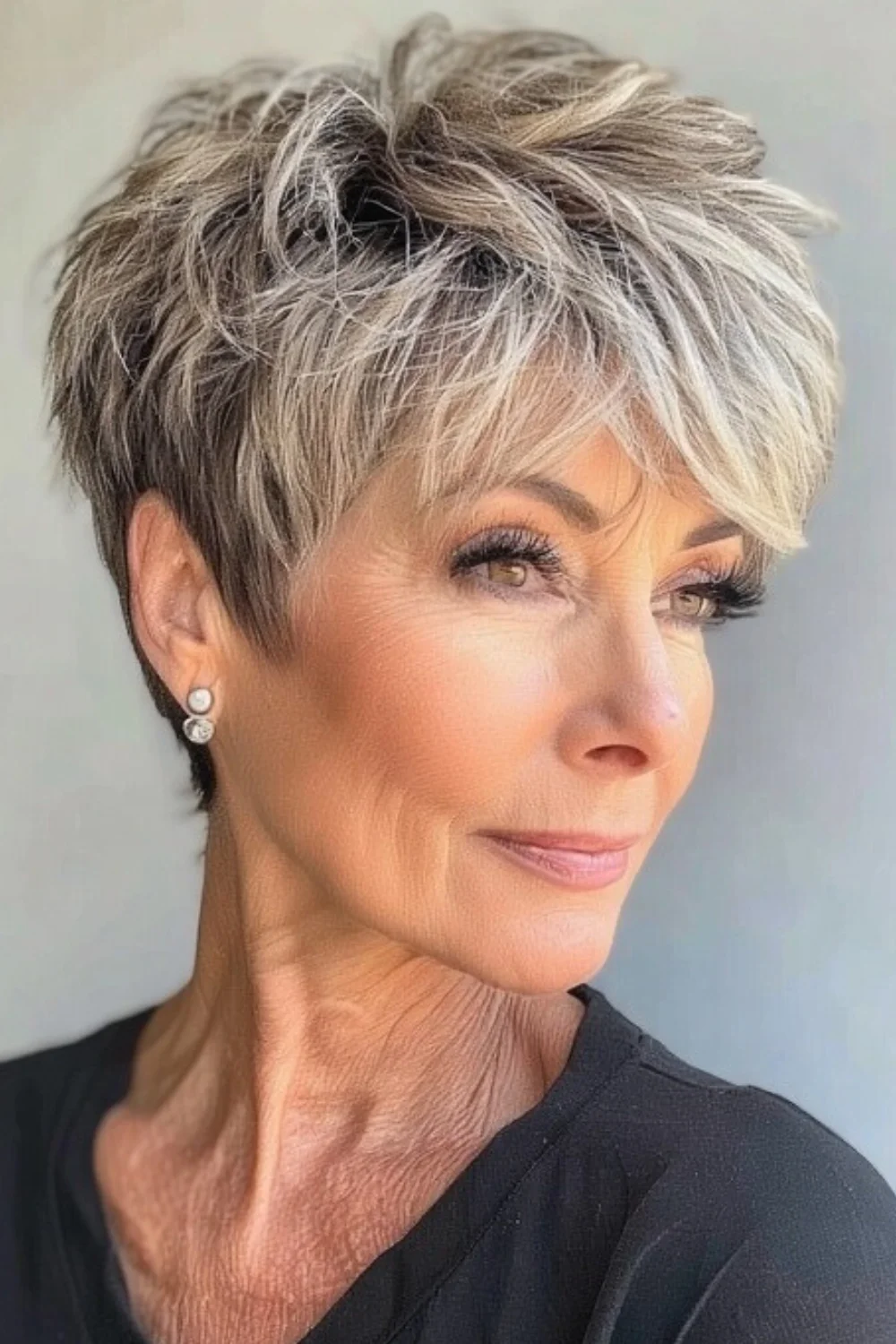 Pixie cut featuring soft fringe and layered texture 