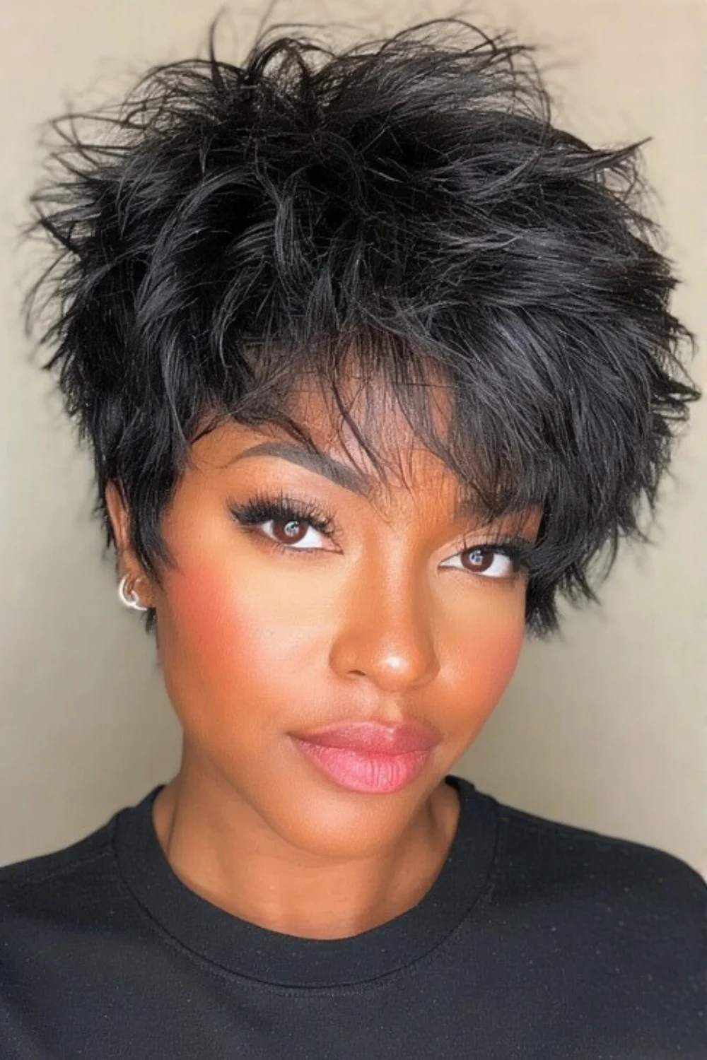 Shaggy short layered haircut with textured finish
