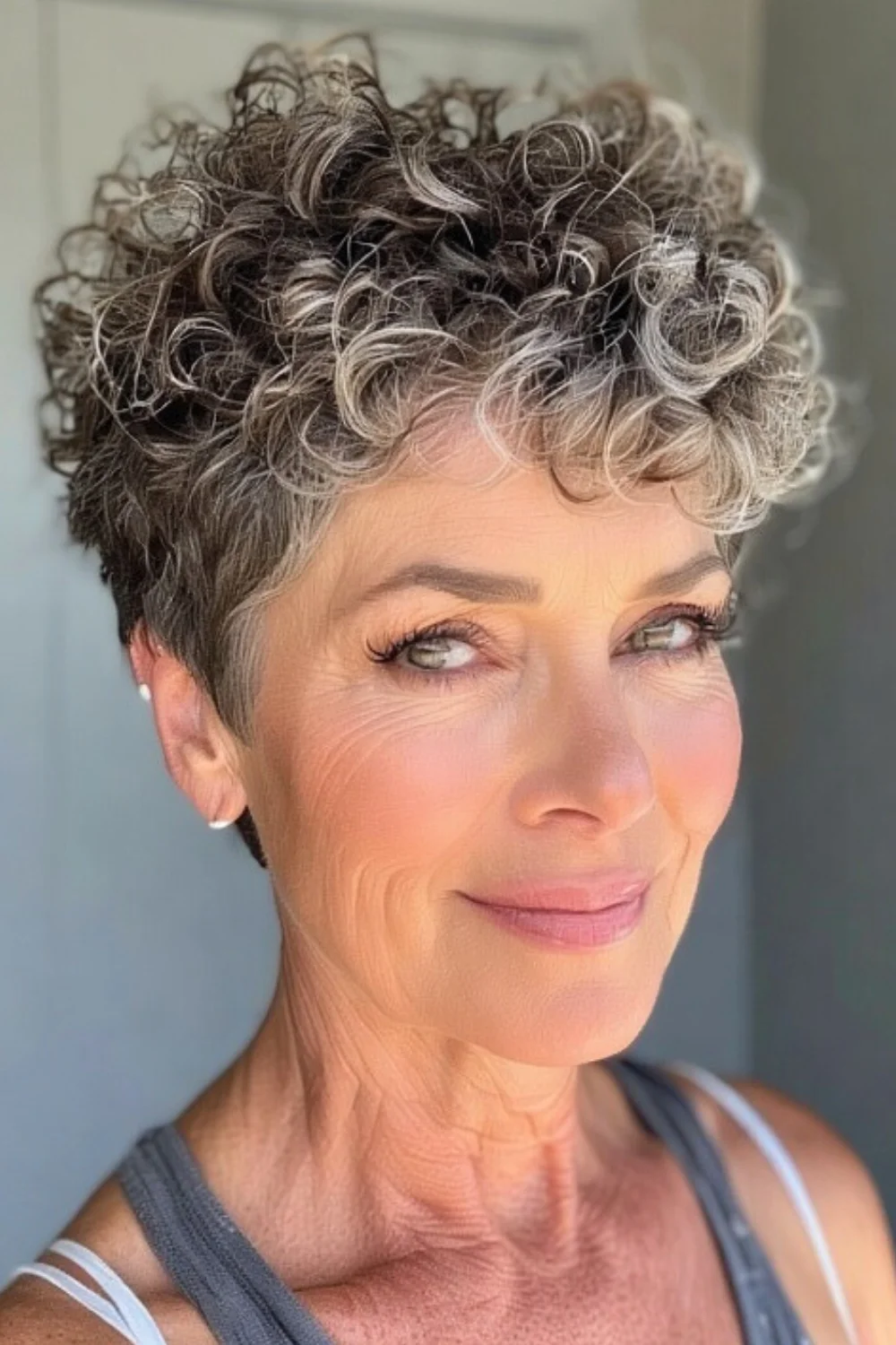 Short layered curls hairstyle featuring bangs
