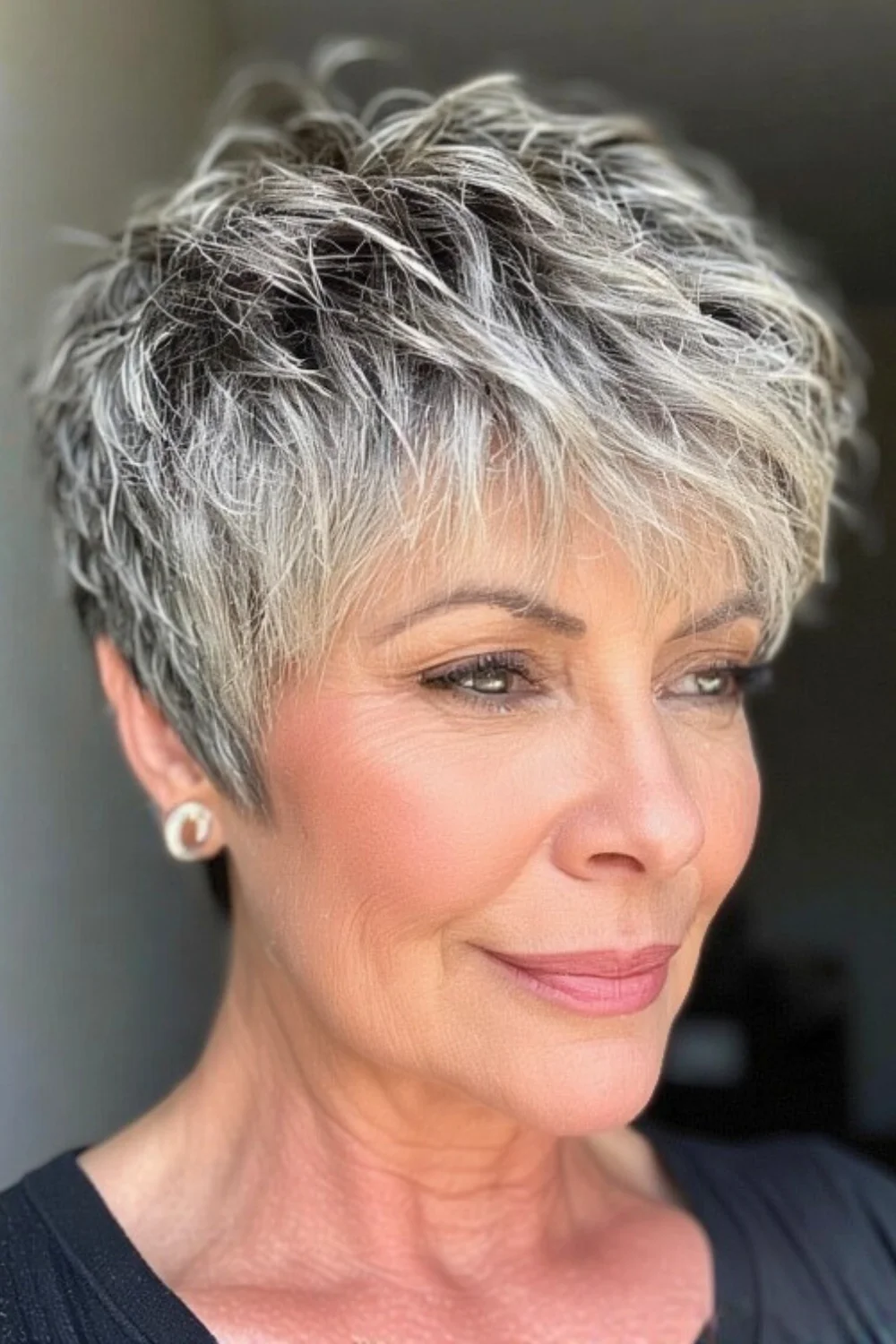 Short pixie haircut with intentionally messy textured look
