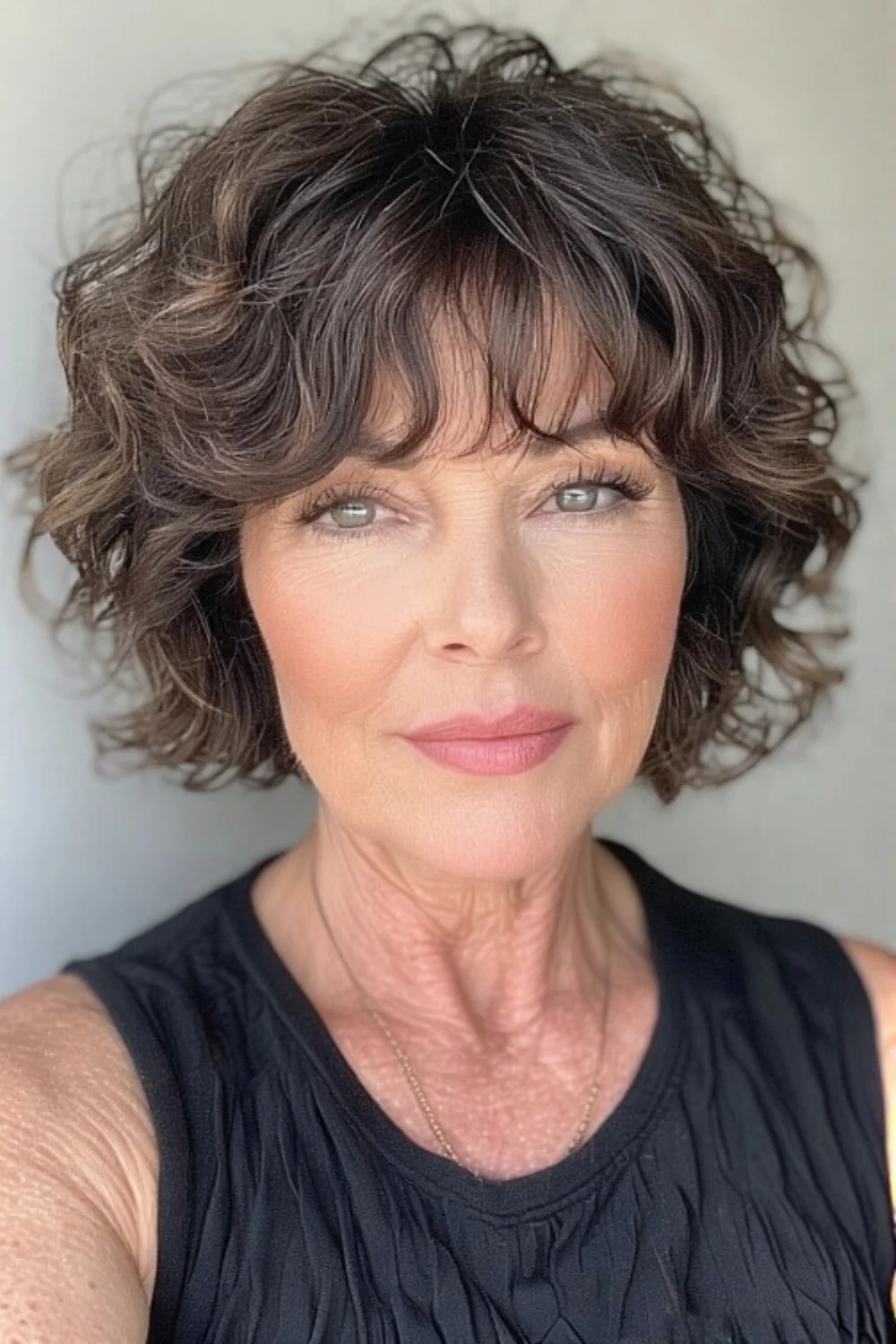 Short wavy bob hairstyle complemented by bangs
