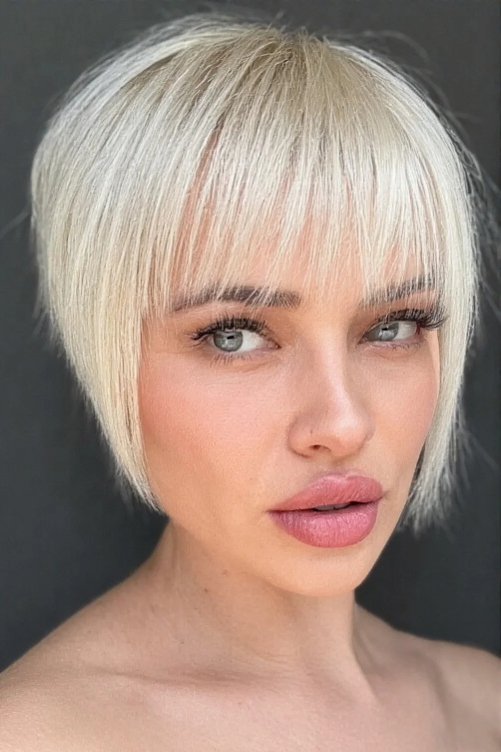 Sleek and straight pixie bob hairstyle with shine

