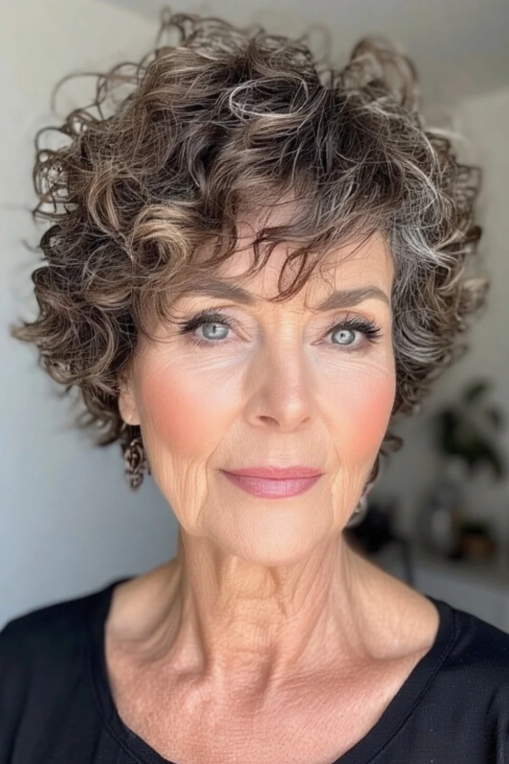 Soft short curls paired with fringe bangs
