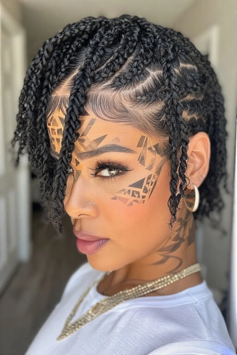 Short box braids featuring trendy geometric patterns
